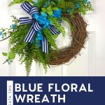 grapevine wreath with blue florals, greenery, and blue and white stripe bow