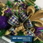 mardi gras centerpiece with gold, purple, and green glitter stems, bow, and fleur di lis attachment