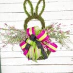 Moss Bunny door hanger with pink florals and pink and green bow