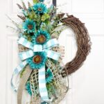 blue sunflower wreath hanging on a white door