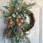 grapevine wreath with greenery and florals for everyday front door decor