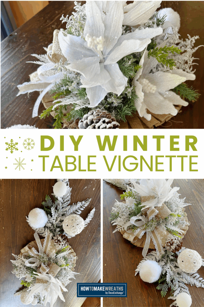 DIY winter table vignette featuring white poinsettias, frosted greenery, pinecones, and ribbon arranged on a dark wood table.