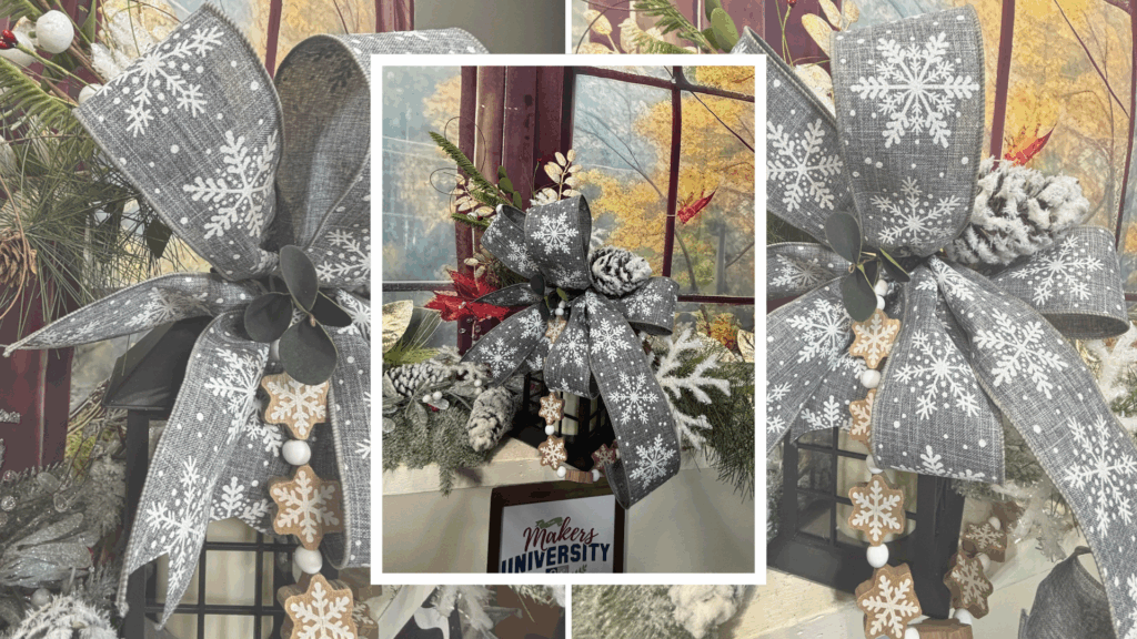Winter mantle display featuring a black lantern with snowflake ribbon, frosted pine, and greenery.