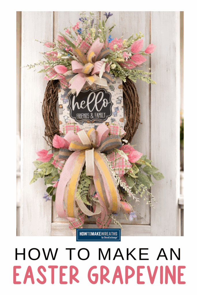Easter grapevine wreath with hello sign, pink ribbon bow, mixed greenery, and floral accents styled on a front porch door.