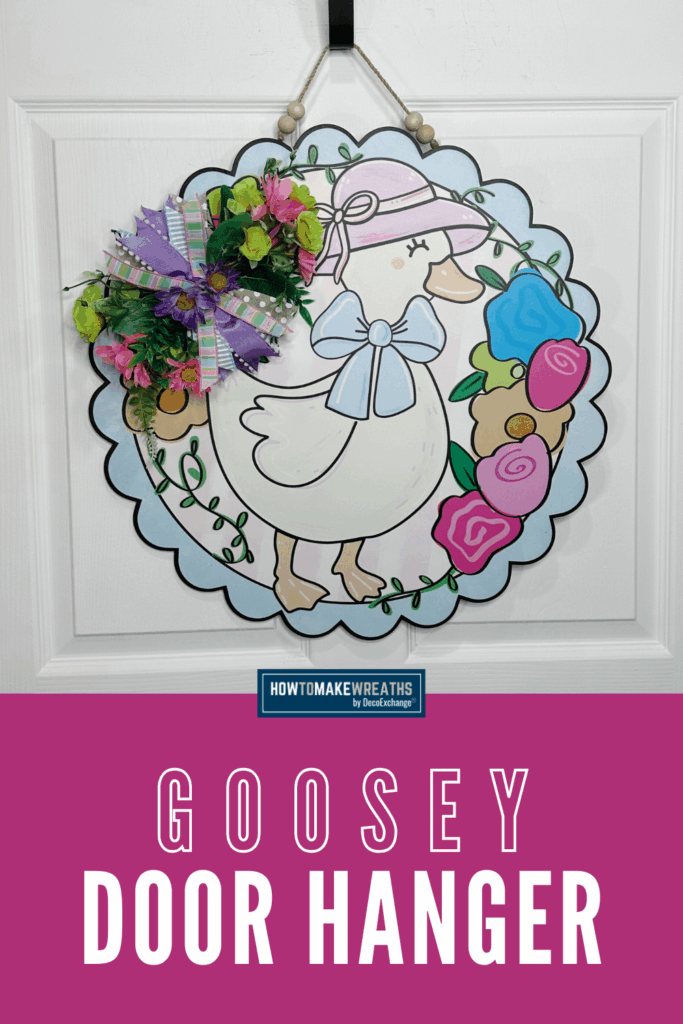 Wooden spring goose door hanger with pastel ribbon bow and bright faux daisies attached to scalloped round sign.