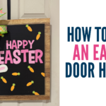 Spring Easter door hanger with a wood-framed black sign that says Happy Easter in pink letters, decorated with carrots, a white bunny, and a pastel plaid and lavender ribbon bow.