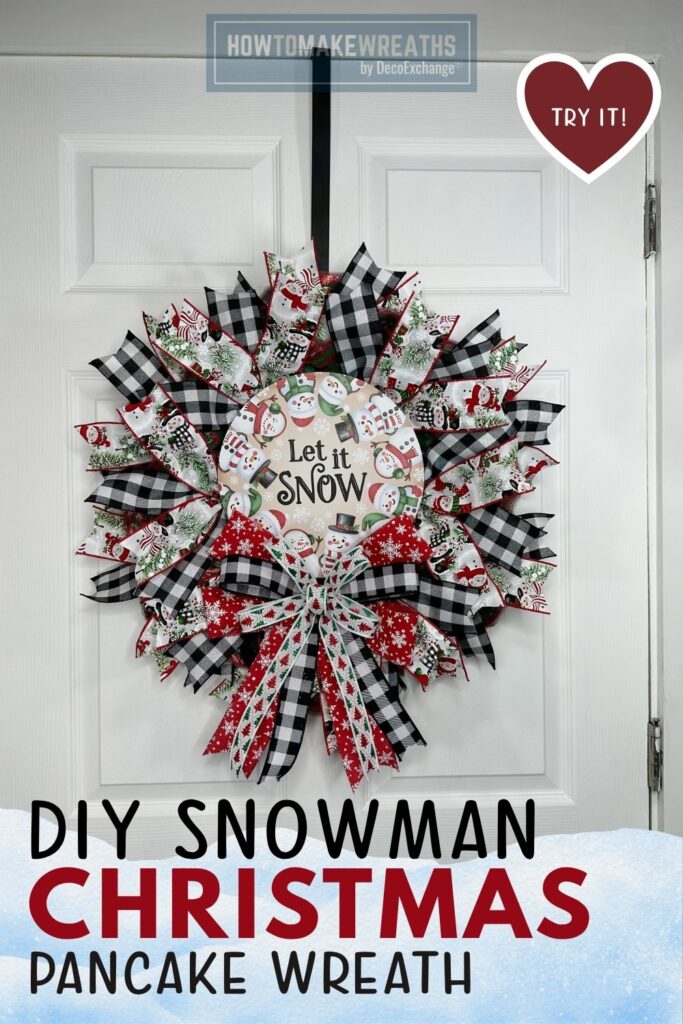 Handcrafted snowman pancake wreath on a front door.
